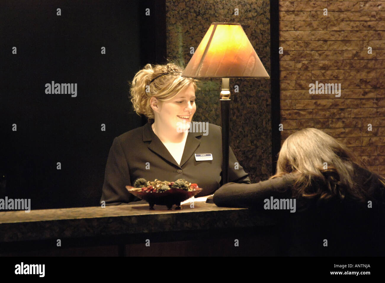 Hotel Lobby Receptionist on the late shift Stock Photo Alamy