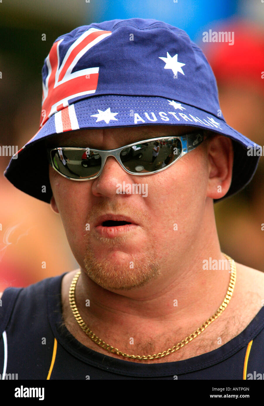 An Aussie male with nationalistic Flag sun hat and sun glasses Stock Photo