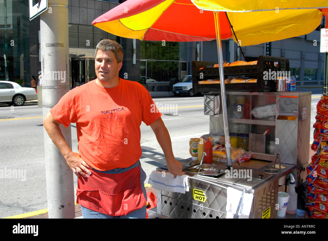 Adult male Hotdog seller on a street corner in downtown Indianapolis Indiana IN Stock Photo