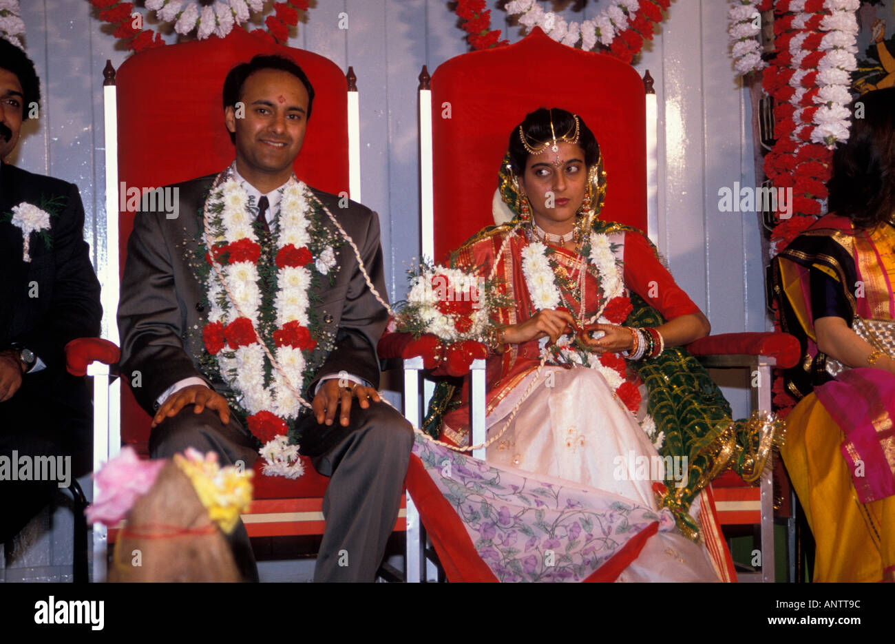 Indian wedding bride and groom joined together with scarves Stock Photo