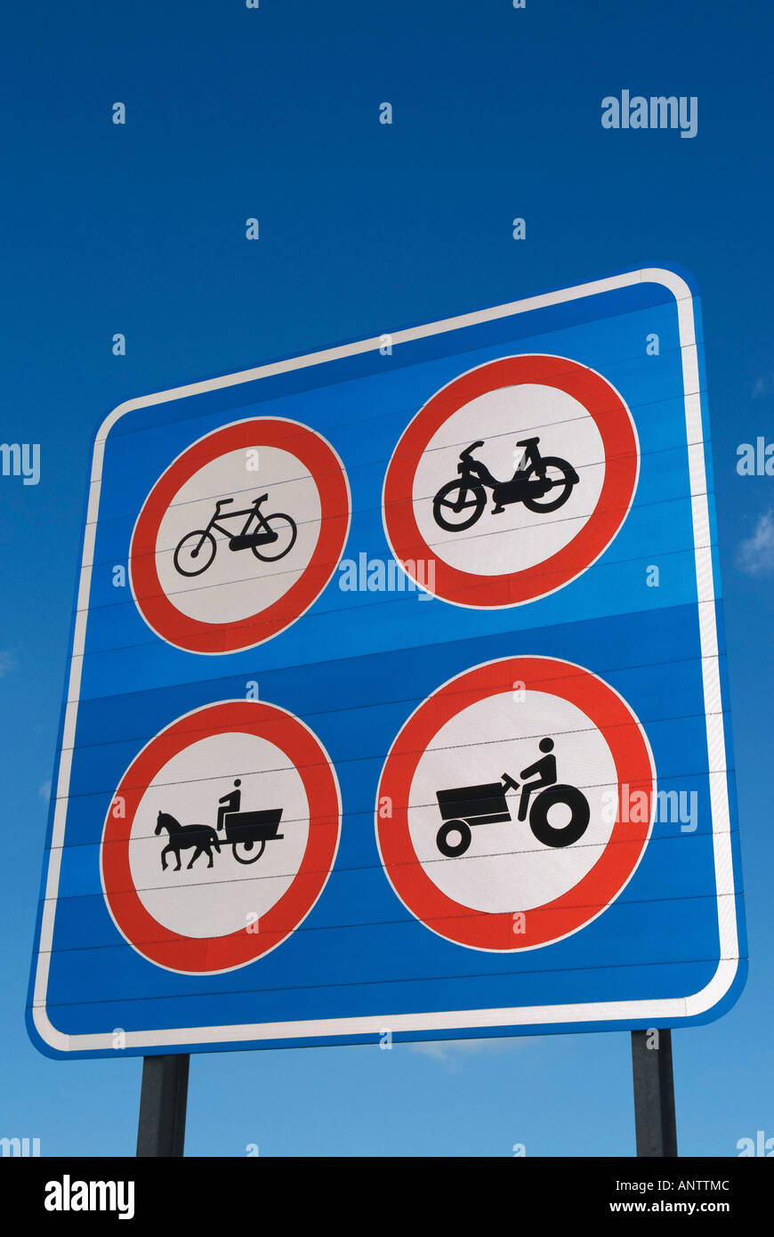 TRAFFIC SIGN  AT ENTRANCE TO MOTORWAY, FOUR 4 TRAFFIC SIGN PROHIBITION TRASPASSING FREEWAY OR MOTORWAY Stock Photo