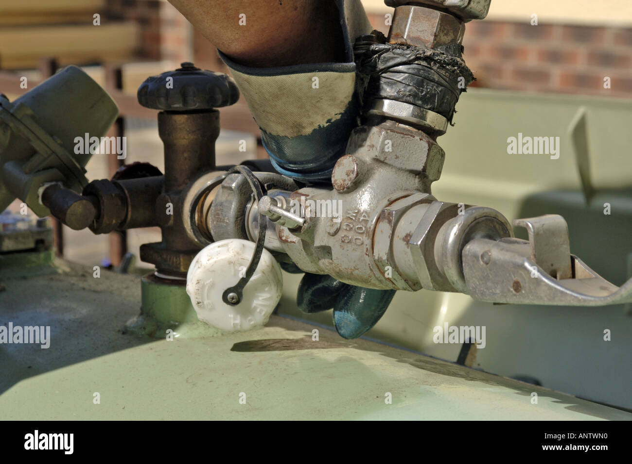 LPG Gas hose connection from the tanker to the domestic tank. Stock Photo