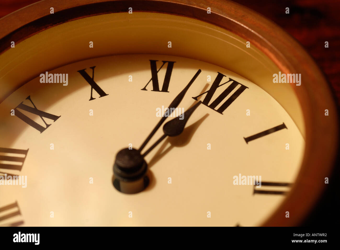 Old fashioned clock with hands at nearly twelve o'clock Stock Photo Alamy