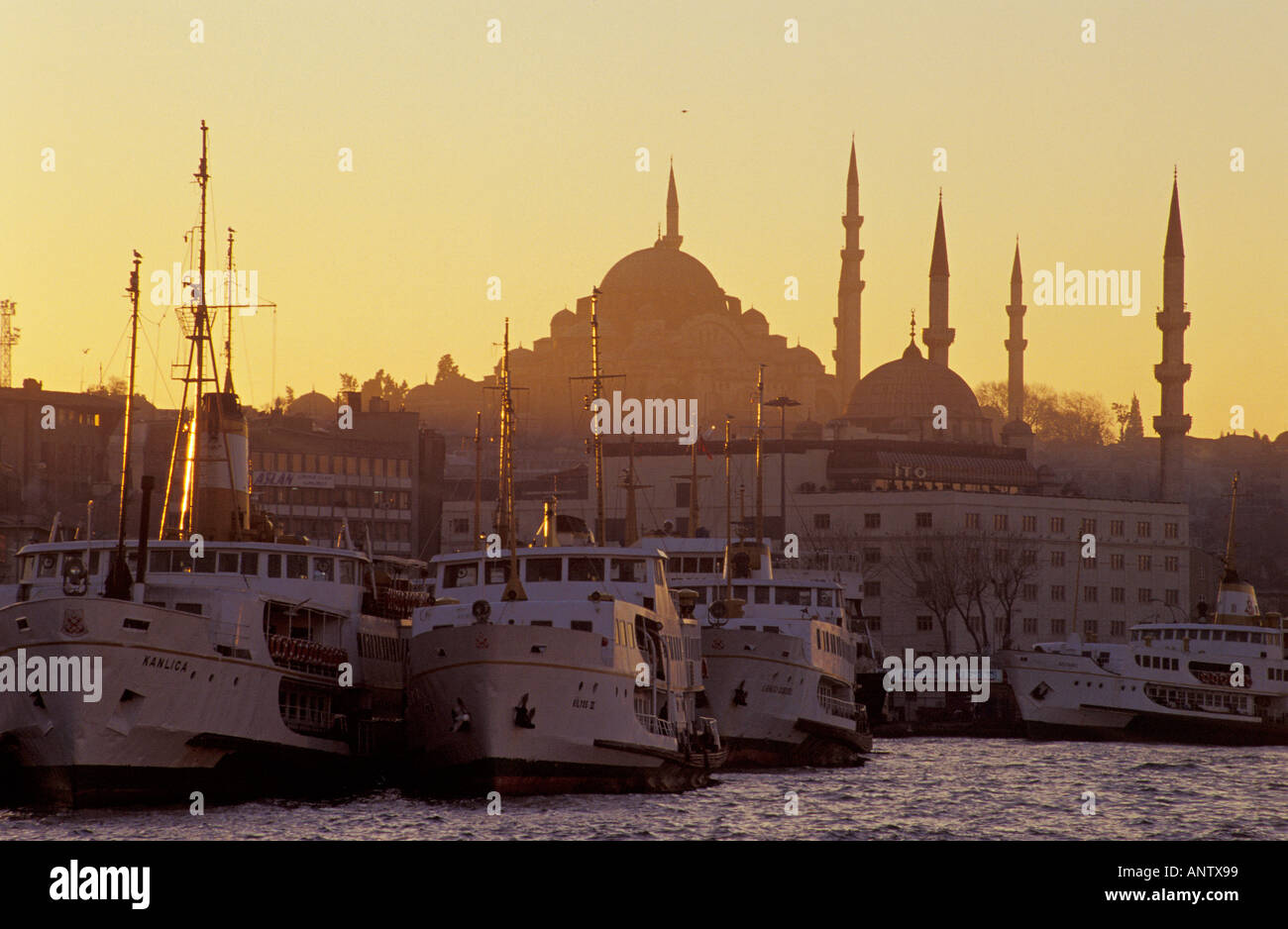 Suleymaniye Mosque at sunset and ferries Istanbul Turkey Stock Photo