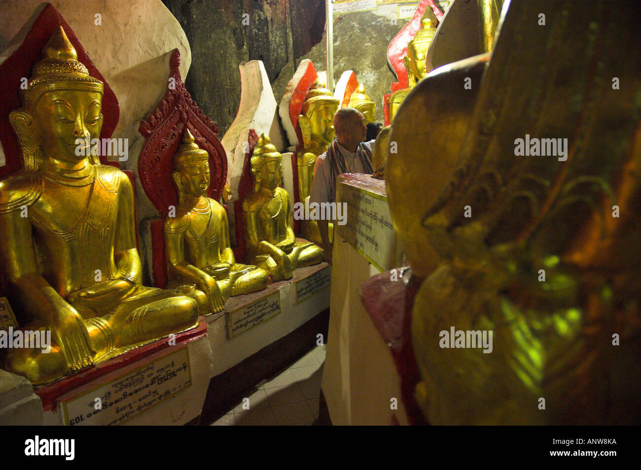 Myanmar Burma Shan State Pindaya Pindaya Natural Cave Museum view with several golden budha figures in artificial light with vis Stock Photo
