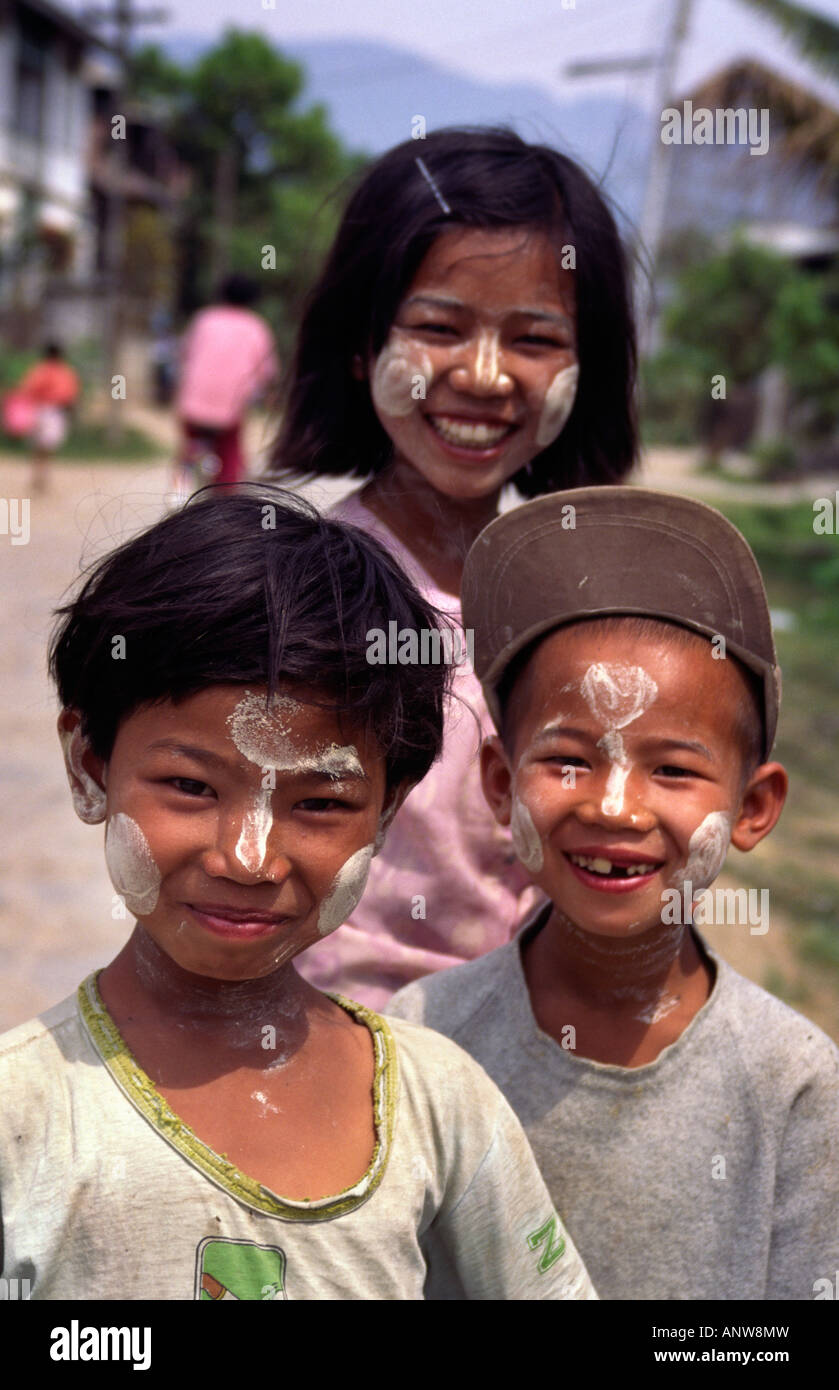 Children with traditional sandalwood face painting. Hsipaw, Shan State