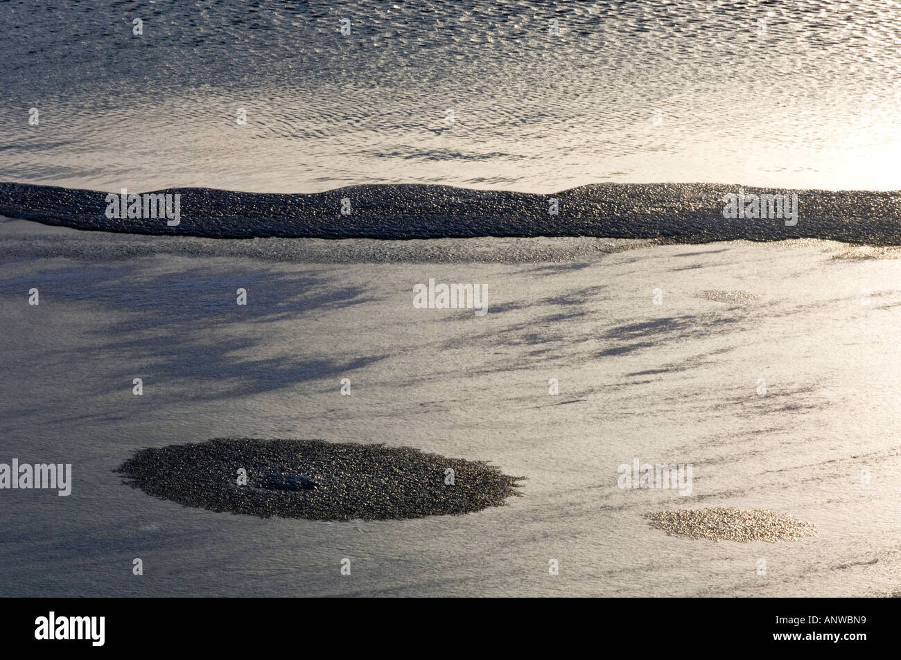 Ice patterns at edge of Vermilion Lakes near sunset, Banff National Park, Alberta, Canada Stock Photo