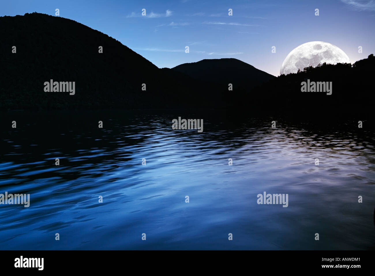 Moon Rising Above the Horizon of Jezero Lake at Twilight Stumpna Bosnia Herzegovina Eastern Europe Stock Photo