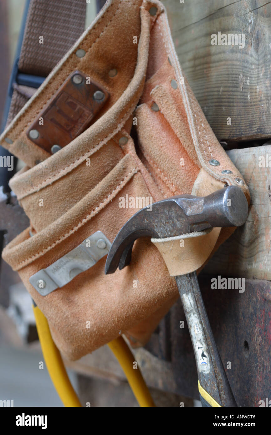 Hammer and tools hanging on leather builders belt Stock Photo Alamy