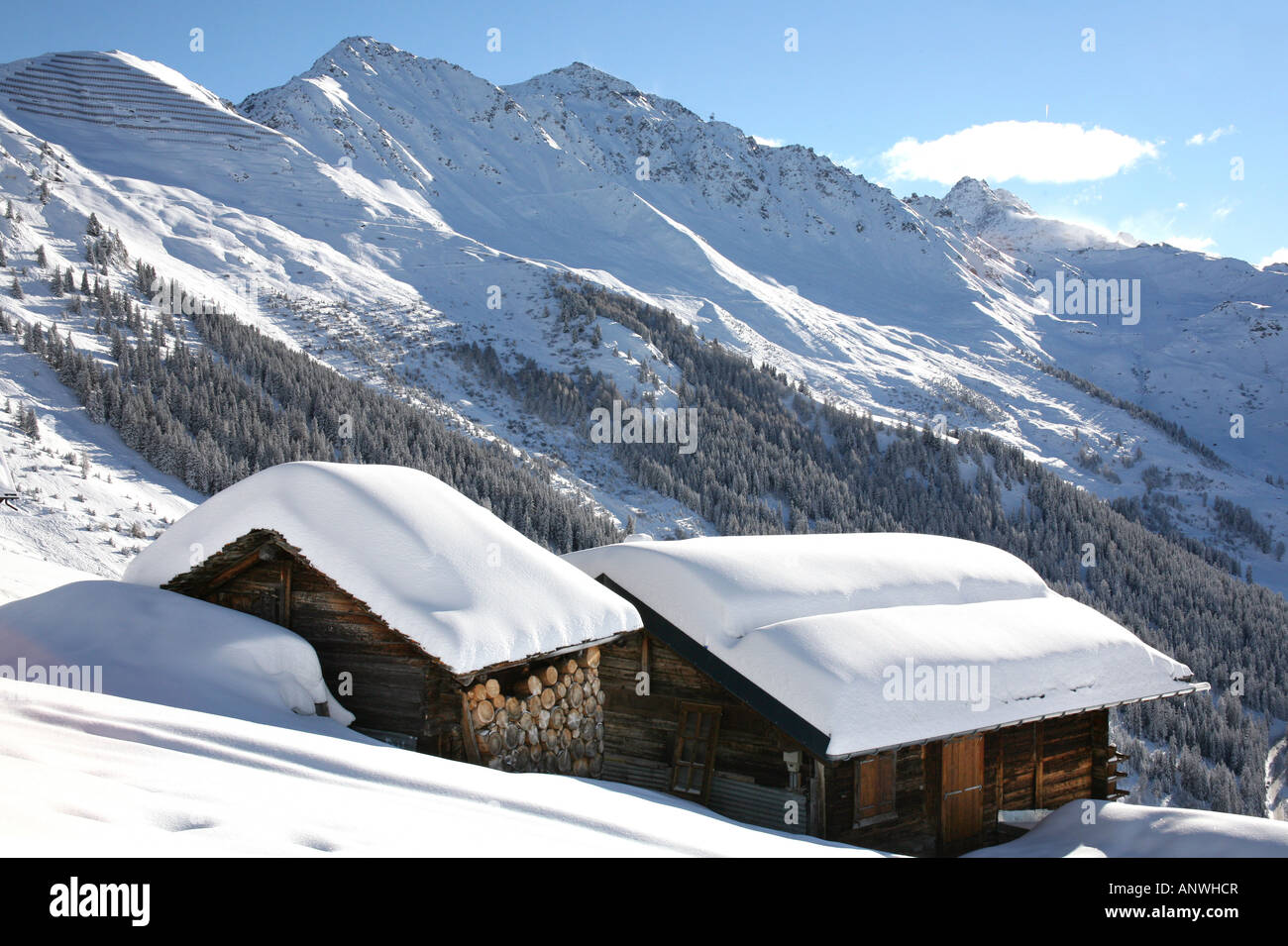 Old summer mountain chalets above the ski resort of Verbier Switzerland Stock Photo