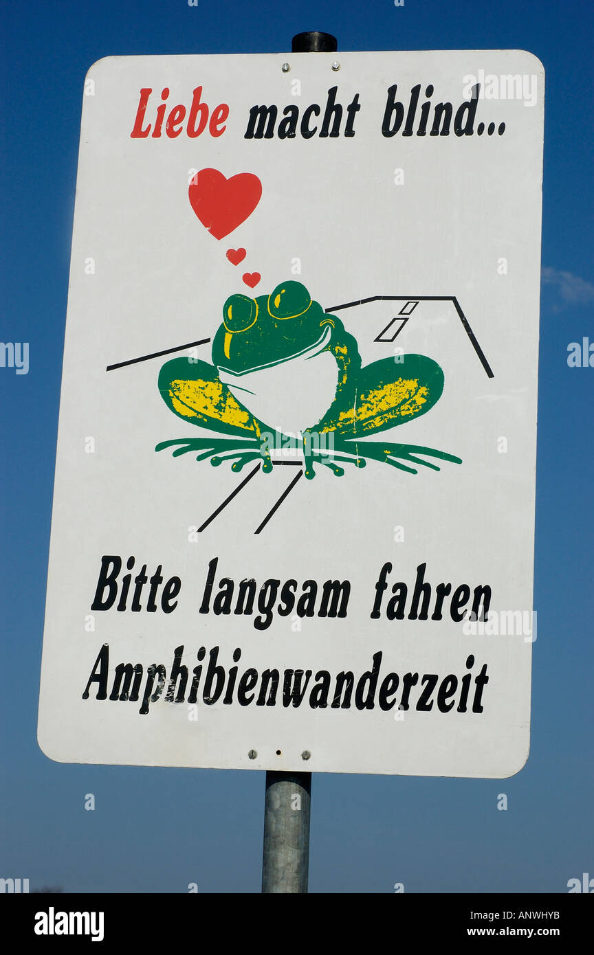 Sign with frog drive slowly, migration of amphibians Stock Photo