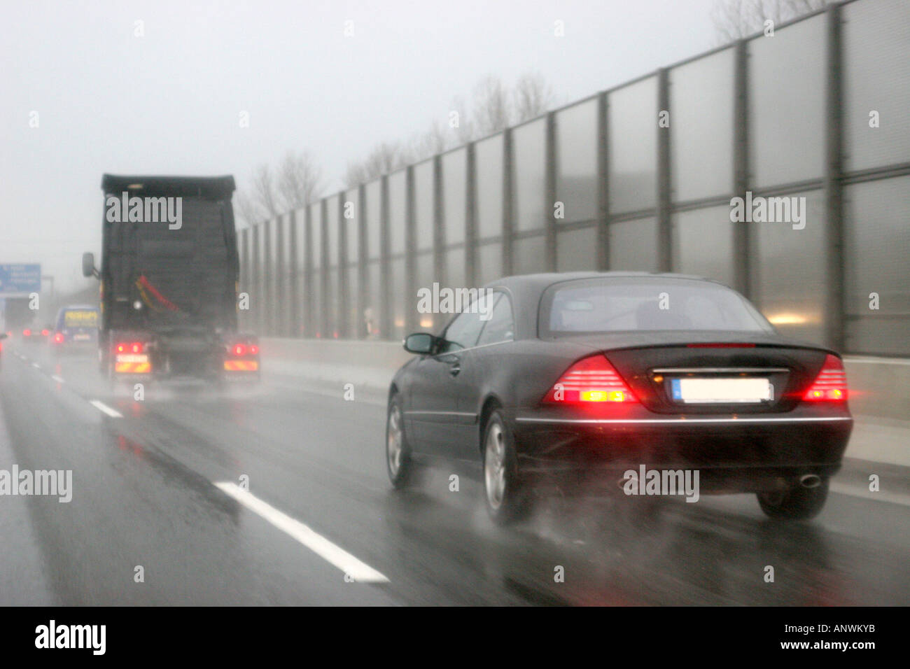 Traffic on wet freeway, danger of aquaplaning Stock Photo