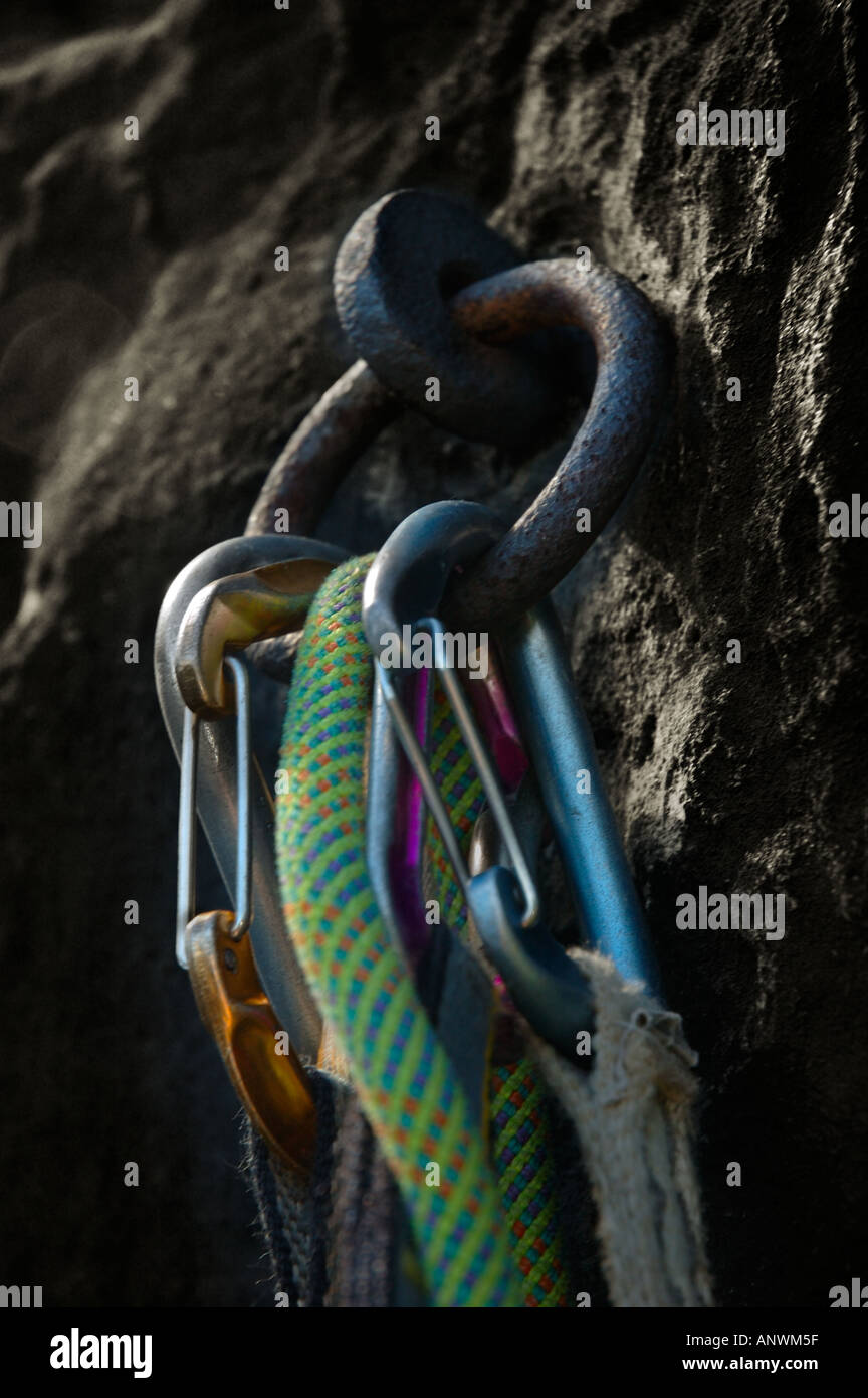 Traditional ring bolt with rope and carabiners used for climbing in the ...