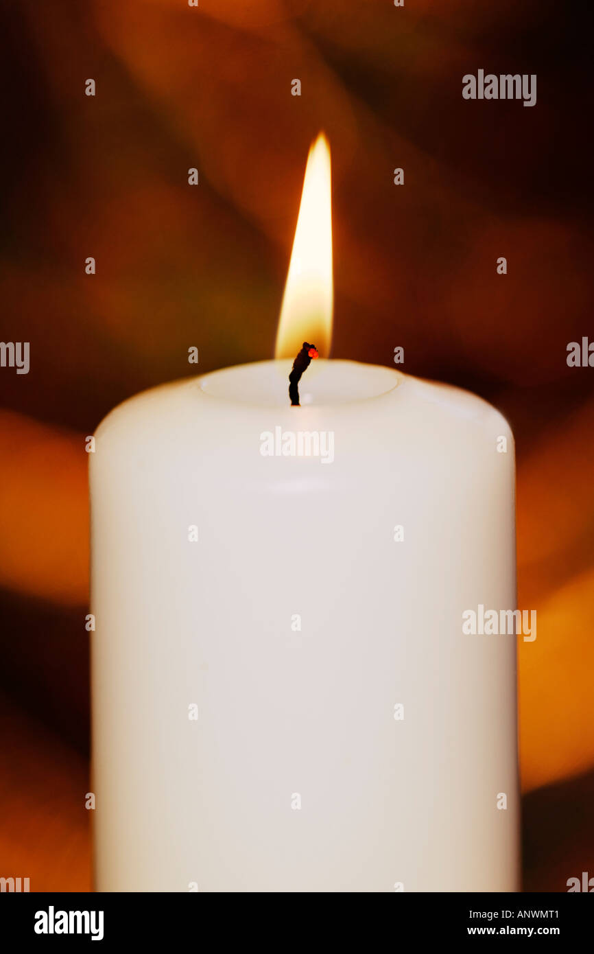 Burning white candle Stock Photo Alamy