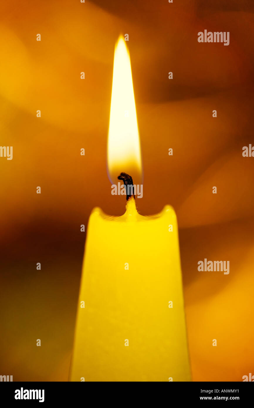 Burning yellow candle Stock Photo Alamy