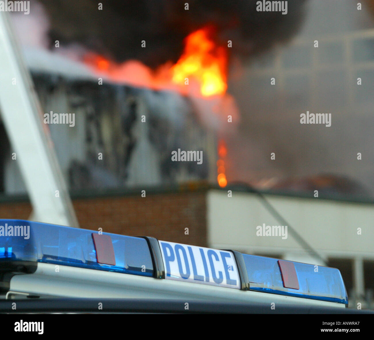 Police car attending school building fire Stock Photo