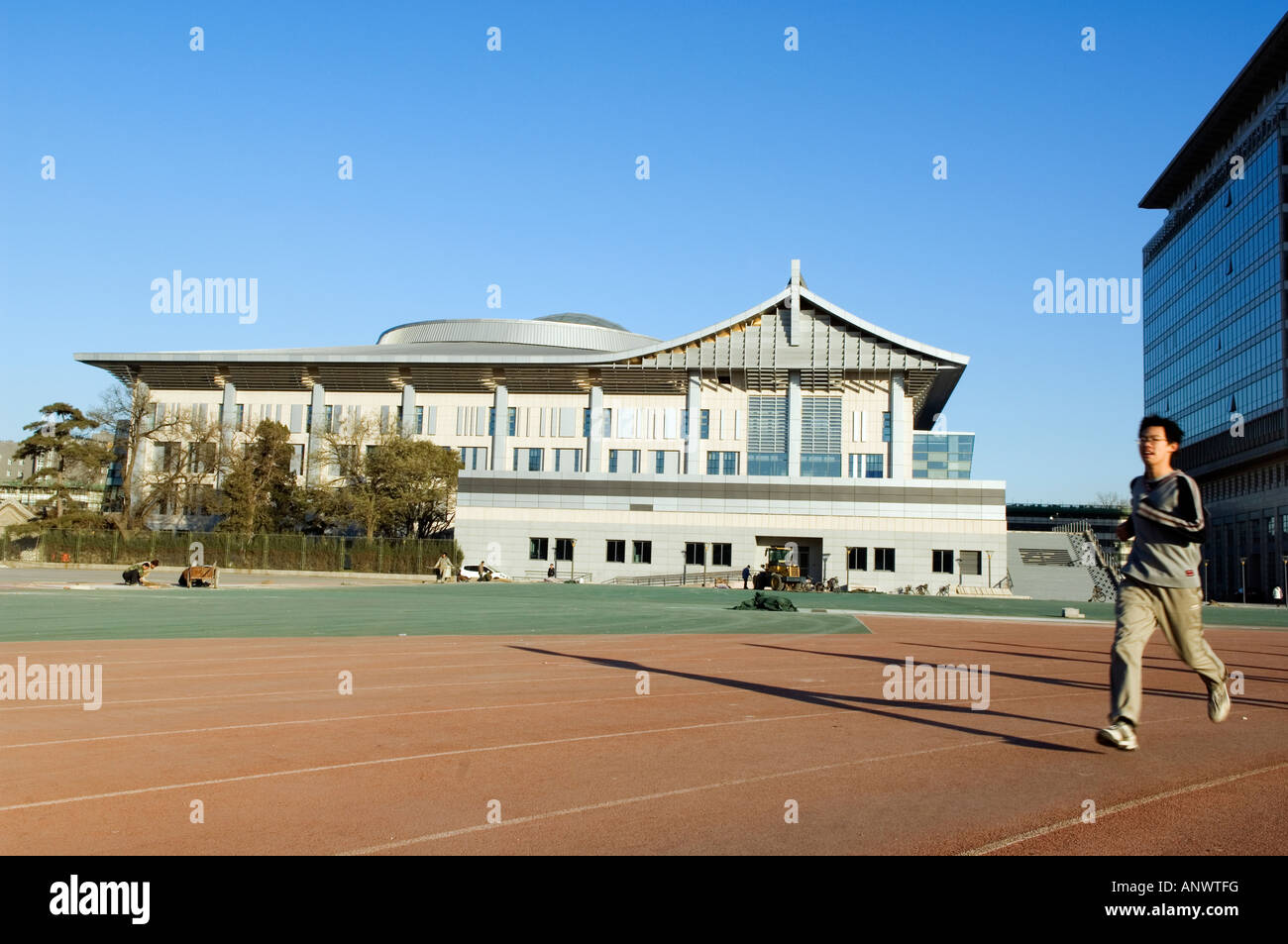 a runner infront of the table tennis stadium 2008 Beijing Olympic venue in Beijing University