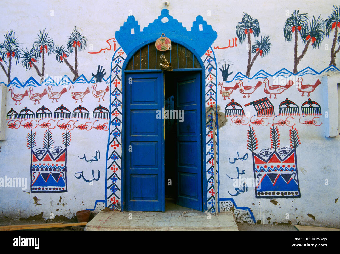 An entrance to a small Nubian village restaurant with an alligator head above the doorway, across the Nile from Luxor, Egypt. Stock Photo