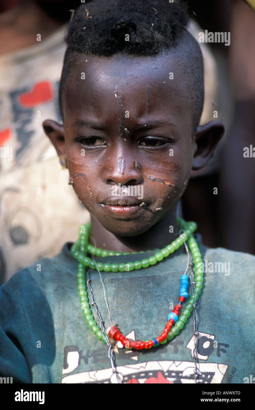 Africa, Ethiopia, Ritualistic scarification on the face of a young Konso boy, in the village of Buso in the Omo river region Stock Photo