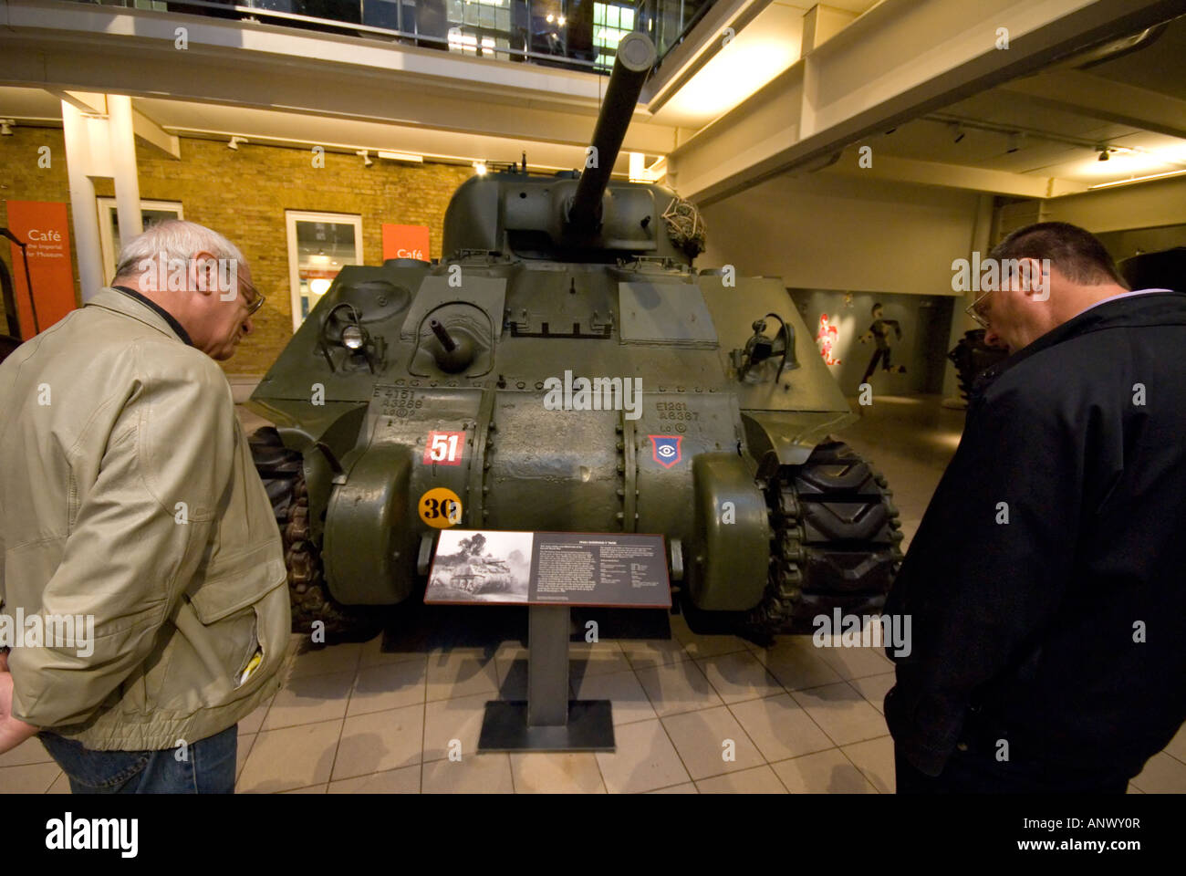 m4a4 sherman v tank two maen reading the green tank description imperial war museum london Stock