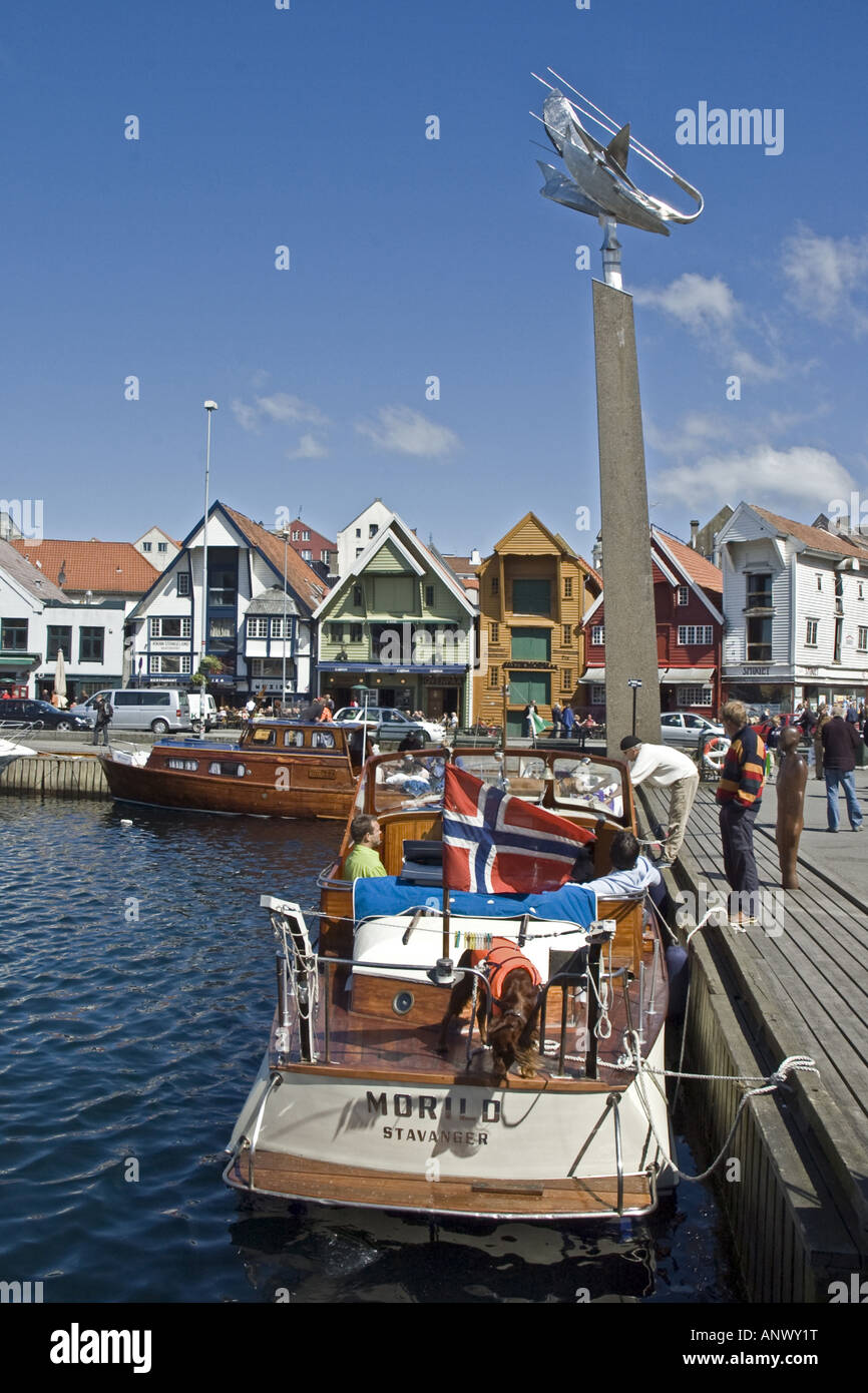 Boats, old buildings and people in the harbour of central Stavanger, Norway Stock Photo