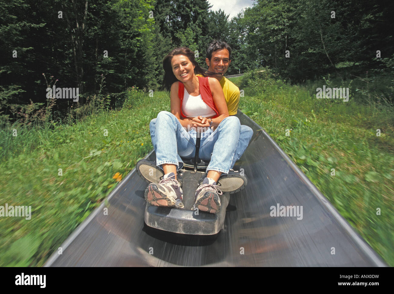 young couple on a all-weather toboggan chute, Austria, Windischgarsten Stock Photo