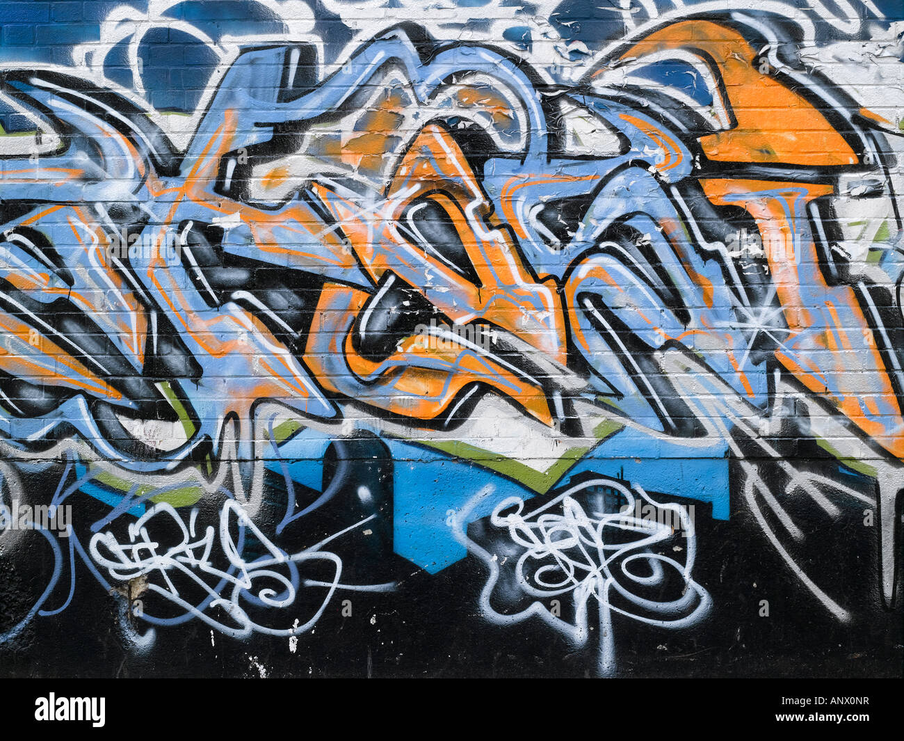 a colourful graffitied wall Stock Photo