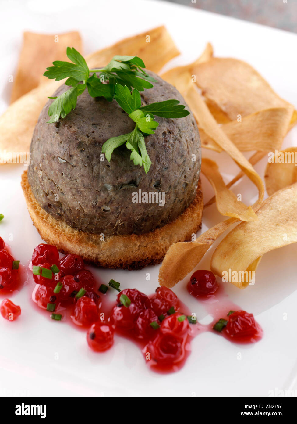 Lamb liver pate with fried parsnip ribbons gourmet editorial party food Stock Photo Alamy