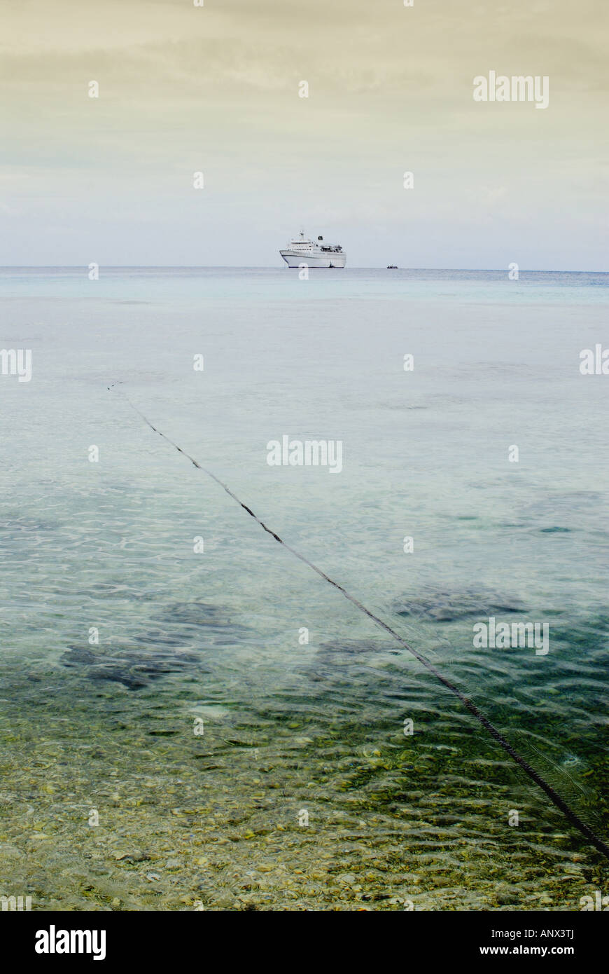 Ship anchoring in a Lagoon in the South Pacific Sea Stock Photo