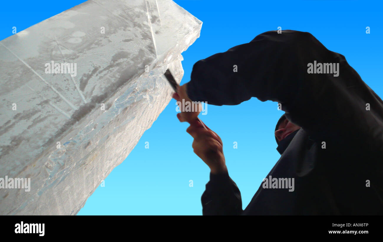 artist modelizing an ice block with a chisel Stock Photo - Alamy