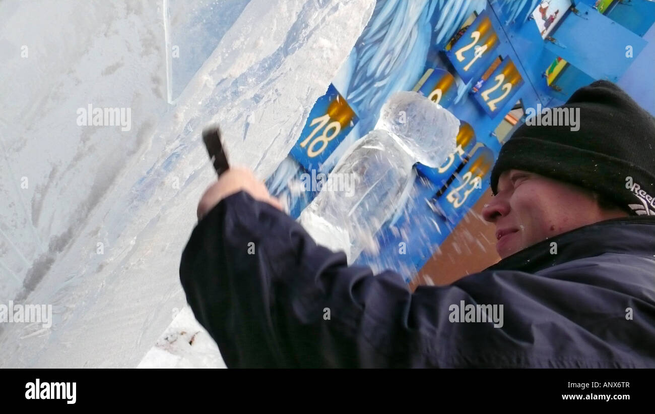 artist modelizing an ice block with a chisel Stock Photo - Alamy