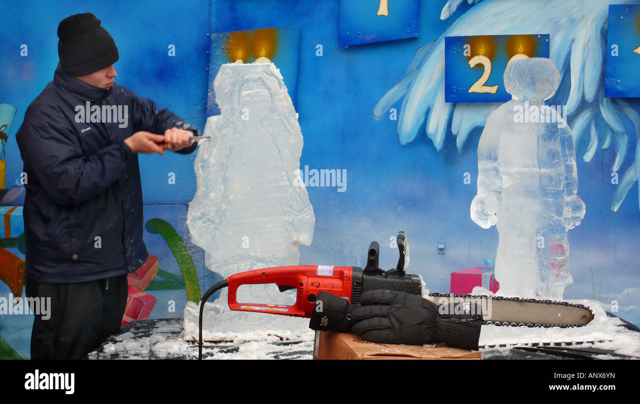 artist modelizing an ice block with a chisel Stock Photo - Alamy
