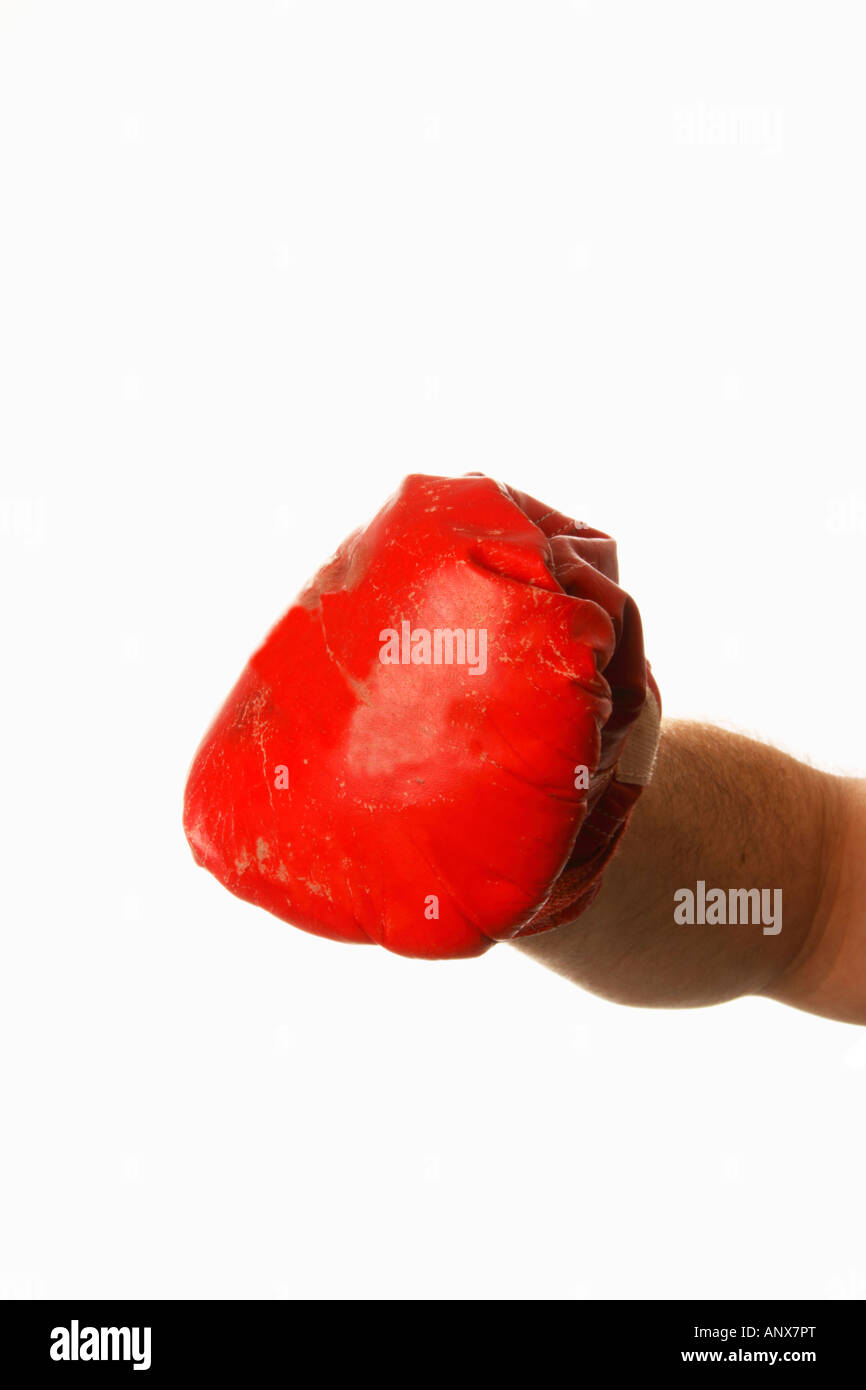 Red boxing glove coming at you, Pow. Stock Photo