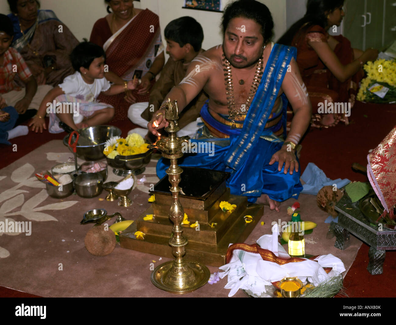 Murugan Temple New Malden Surrey England Priest During Ceremony Lighting the Sacred Fire Stock Photo