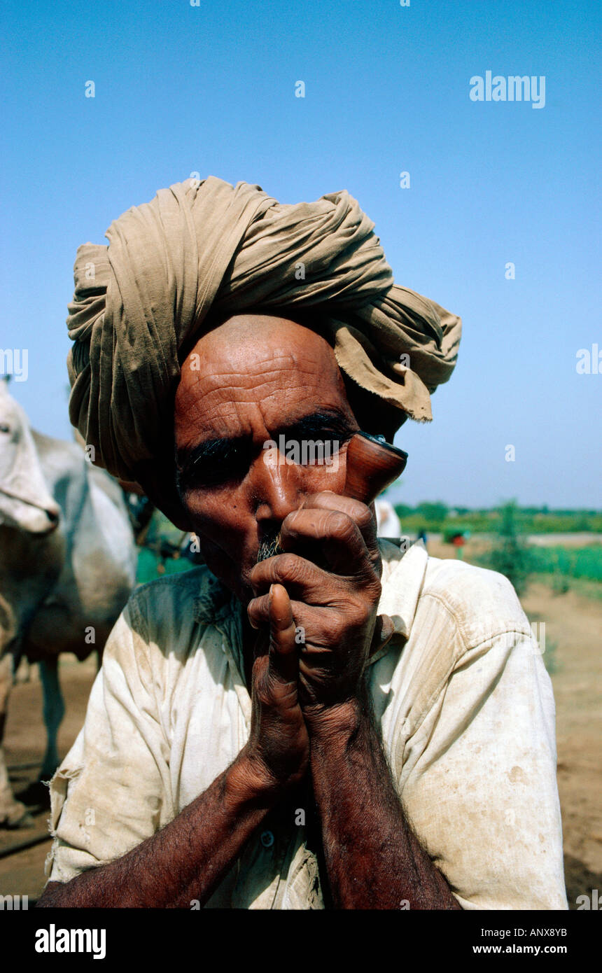 portrait of peasant smoking pipe state of rajasthan india Stock Photo