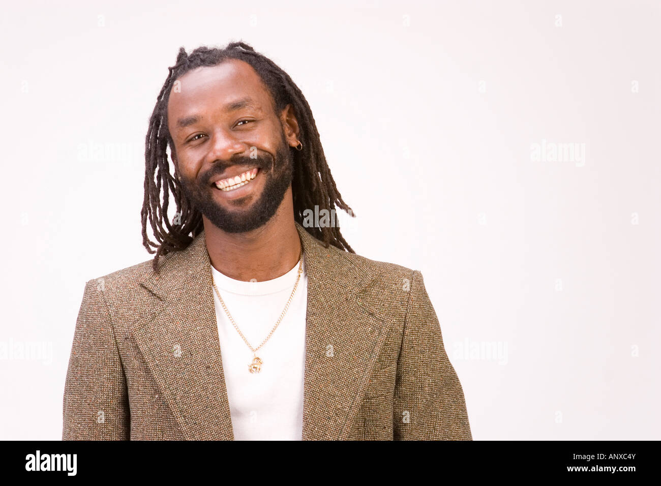A Black Man With Dreadlock Hair Isolated On A White Background