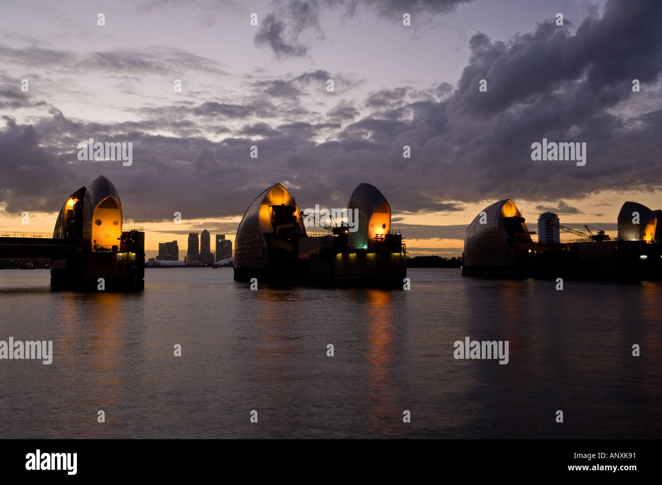 thames barrier river thames london england uk dusk canary wharf in ...
