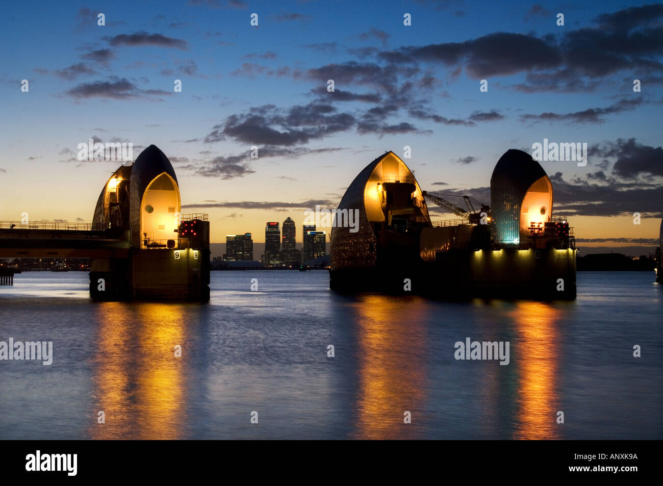 thames barrier river thames london england uk dusk canary wharf in ...