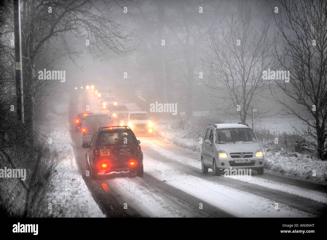 MOTORING IN SNOWY CONDITIONS NEAR WOTTON UNDER EDGE GLOUCESTERSHIRE UK Stock Photo