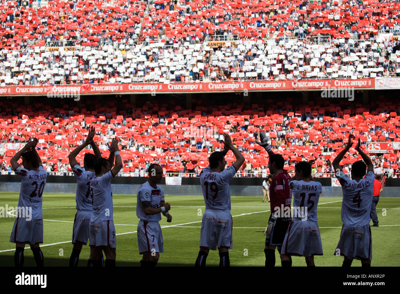 Sevilla FC players greeting their fans who were forming a spectacular red and white mosaic. Stock Photo