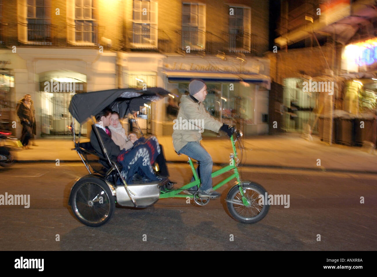 Couple on a Friday Night out in the West end of London Model released rickshaw Stock Photo