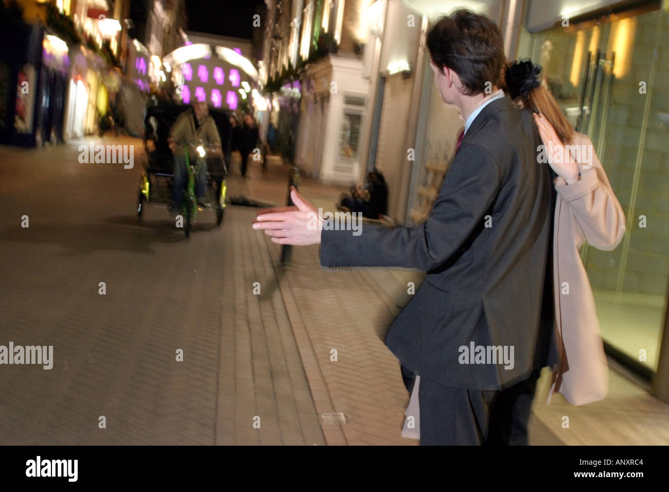 Couple on a Friday Night out in the West end of London Model released rickshaw Stock Photo