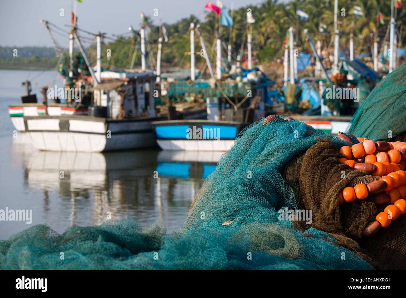 INDIA, Goa, Kutahana Jetty: South Goa's biggest fising port, Fishing Net  Floats and Fishing Boats Stock Photo - Alamy