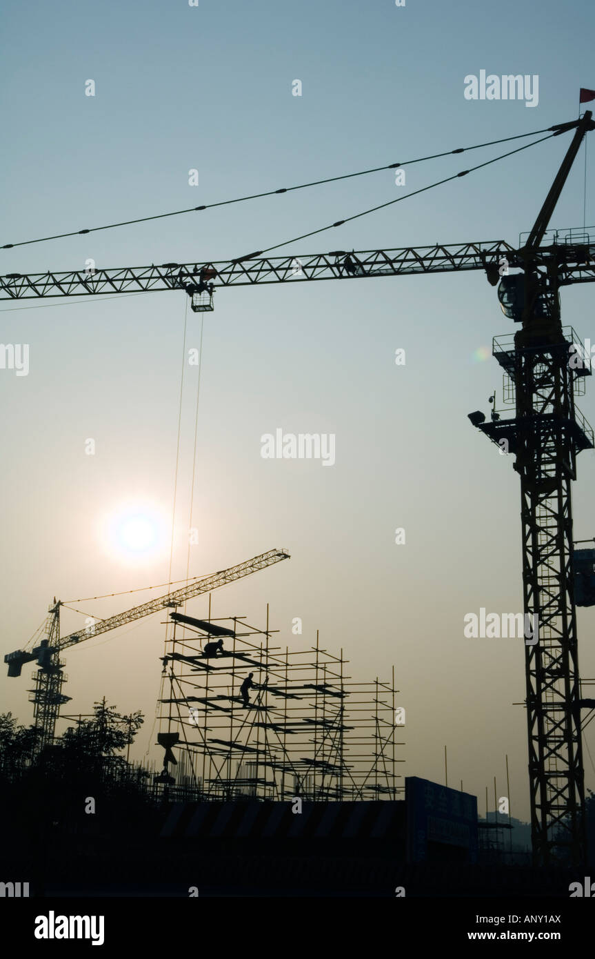sunset over a construction sites cranes in Beijing China Stock Photo