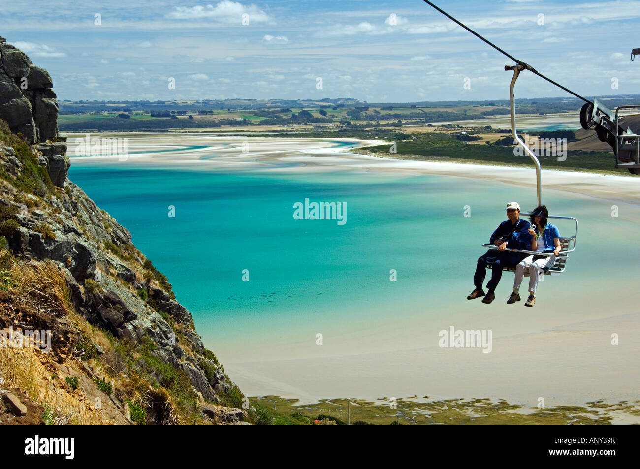 Australia, Tasmania, Stanley, Sawyer Bay. Visitors on the chair lift going to The Nut at Circular Head. Stock Photo