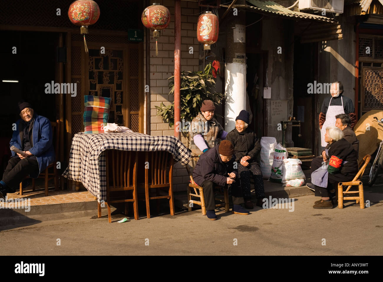 Bedding hangs over chairs to dry and air. Old Town, Shanghai, Peoples' Republic of China Stock Photo