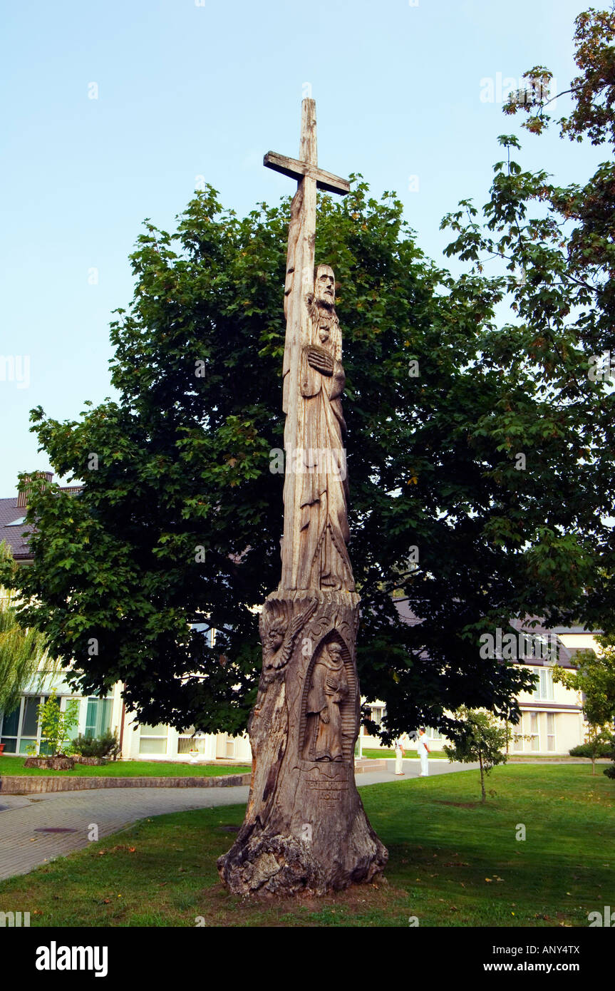 Lithuania, Curonian Spit, Juordkrante. Religious style wooden carvings located outside a local church. Stock Photo