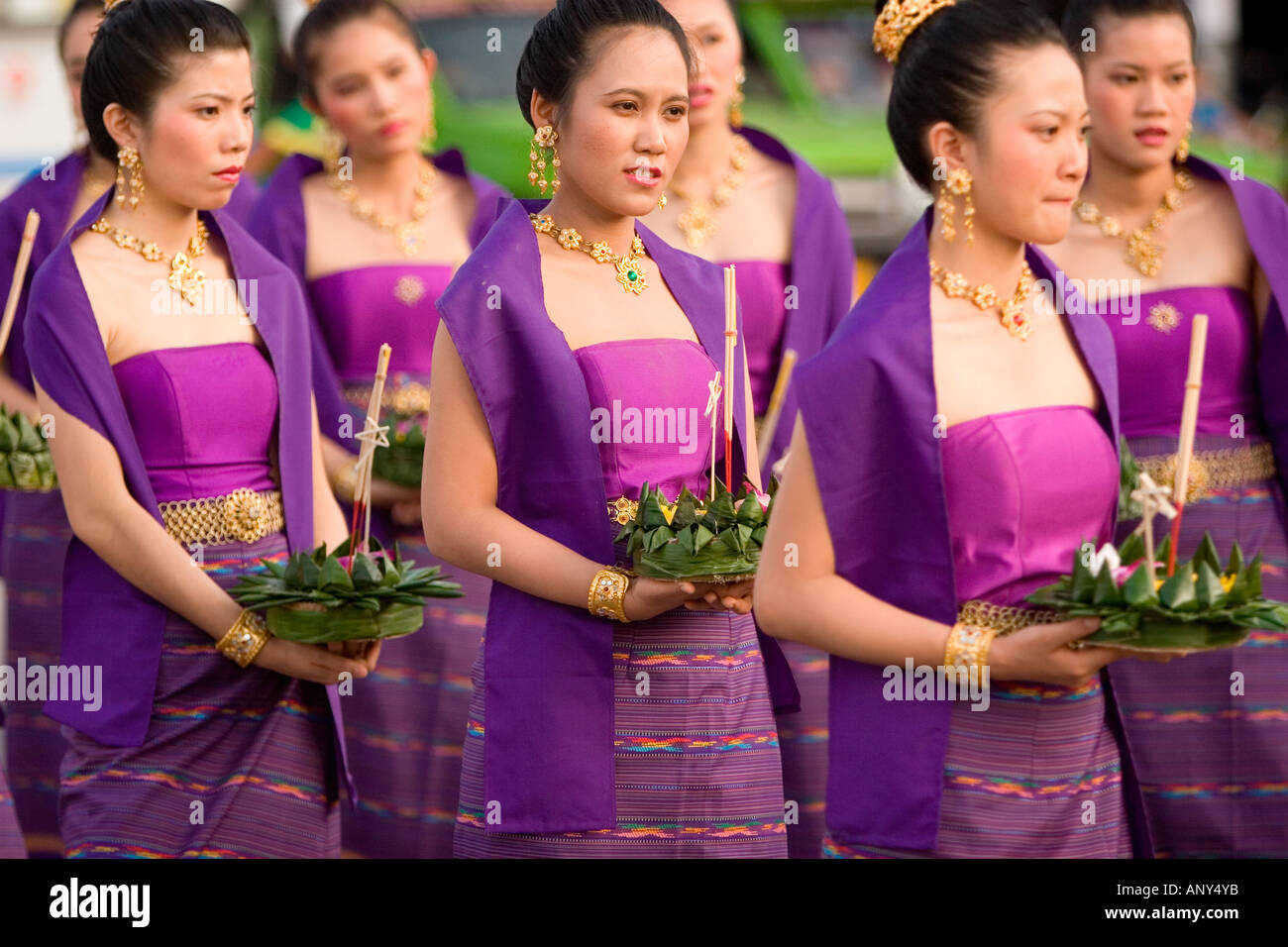 Thailand, Khon Kaen, Girl wearing traditional decoration for the Loy Kratong Celebration holding a kratong Stock Photo