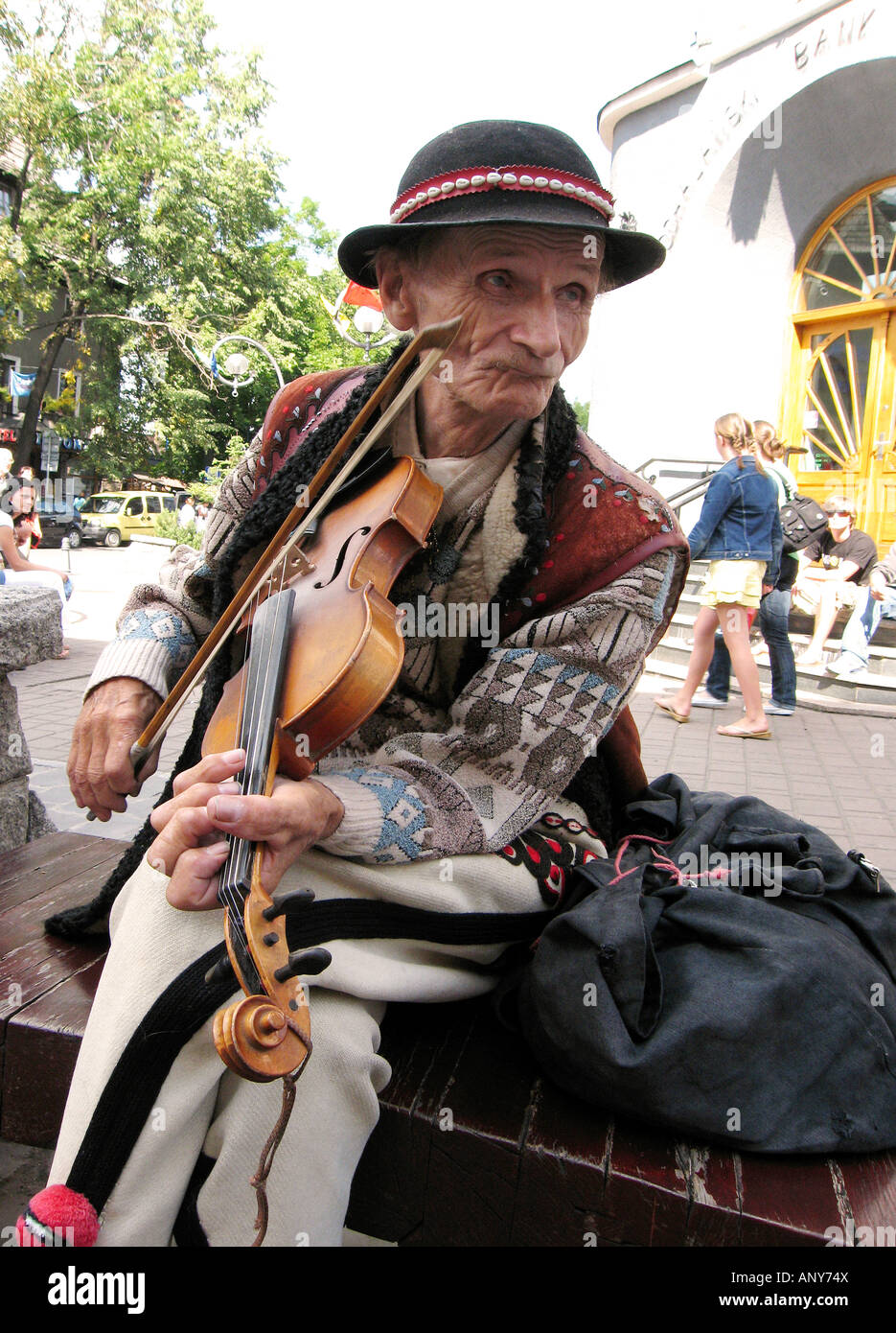 Poland Zakopane town Krupowki Street Goral man playing violin Stock Photo