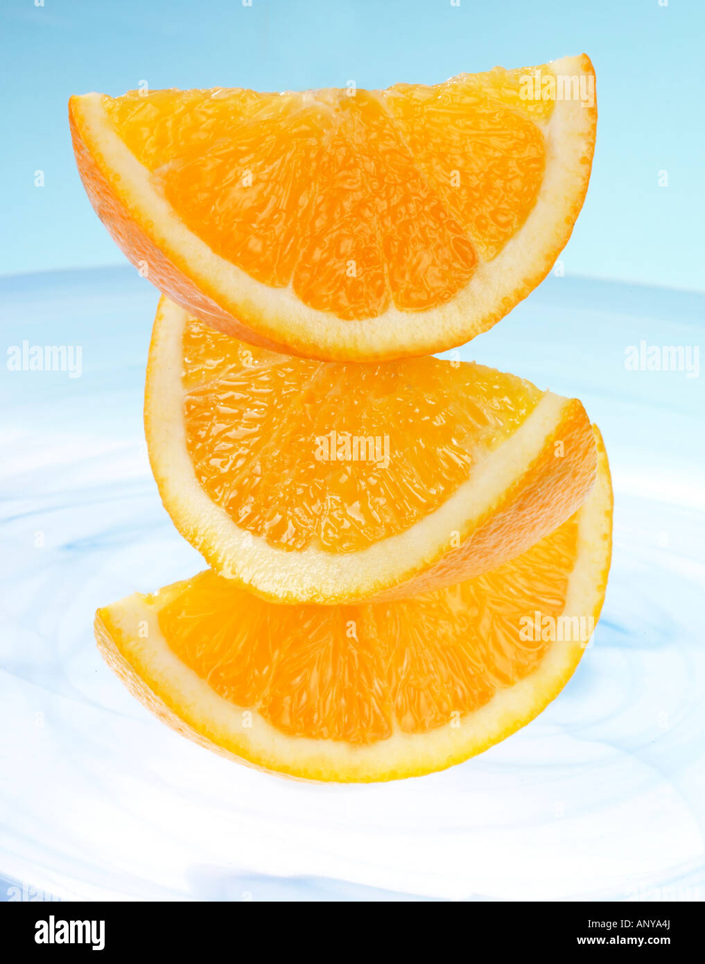 STACK OF THREE ORANGE SEGMENTS Stock Photo Alamy
